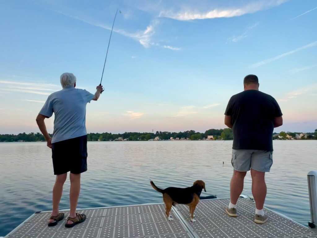 Bruin The Lab Beagle Watches His Family Fish From Their Dock.